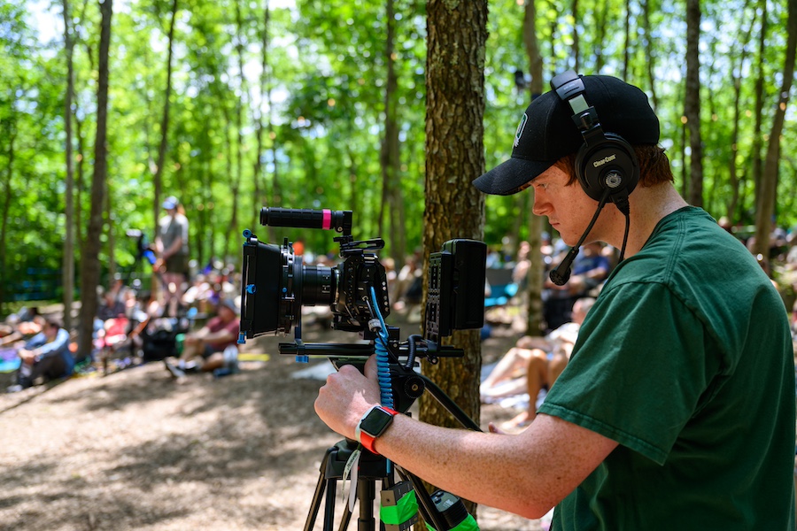 Student working behind camera