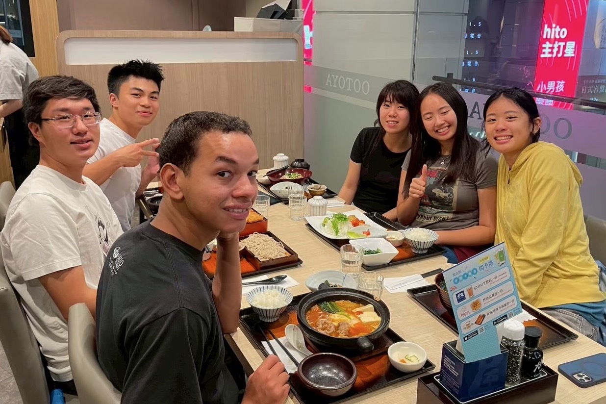 Owen Vandivier eats hotpot with his co-teachers.