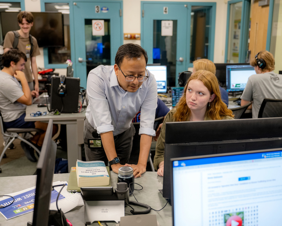 Atish Baidya WOUB editor in the studio at Ohio University