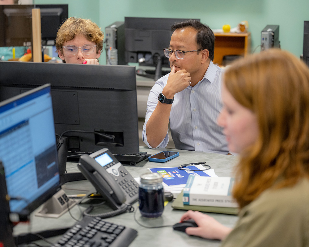 Atish Baidya and OHIO students work at WOUB