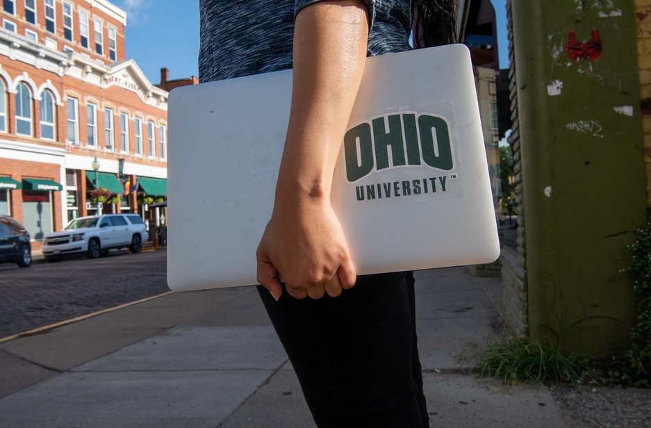 A laptop with an "Ohio University" sticker.