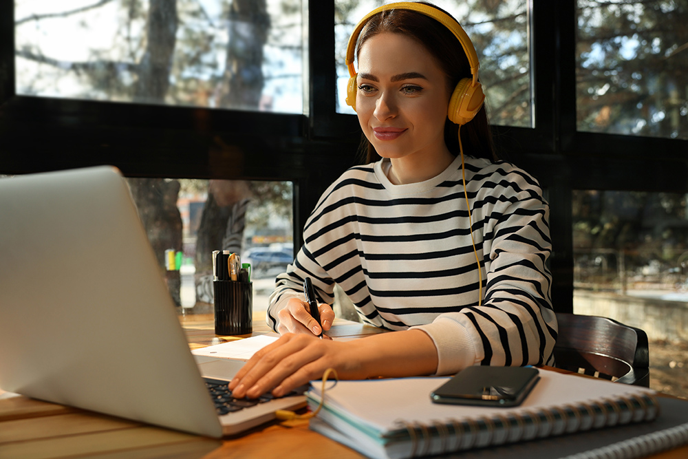 Girl studying by window 