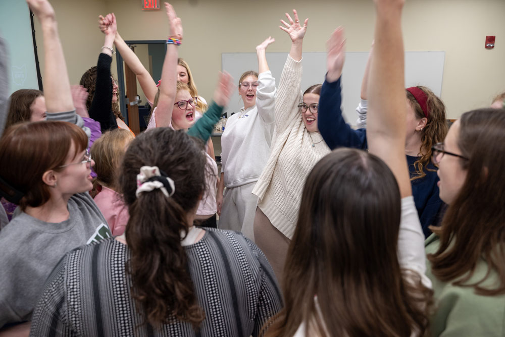 OU Sparkles celebrating at the end of their practice.