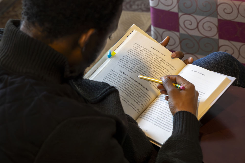 A student reading at the Drop Everything and Read event