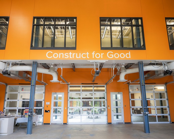 The two-story high Kokosing Teaching Laboratory. On the wall are the words "Construct for Good"