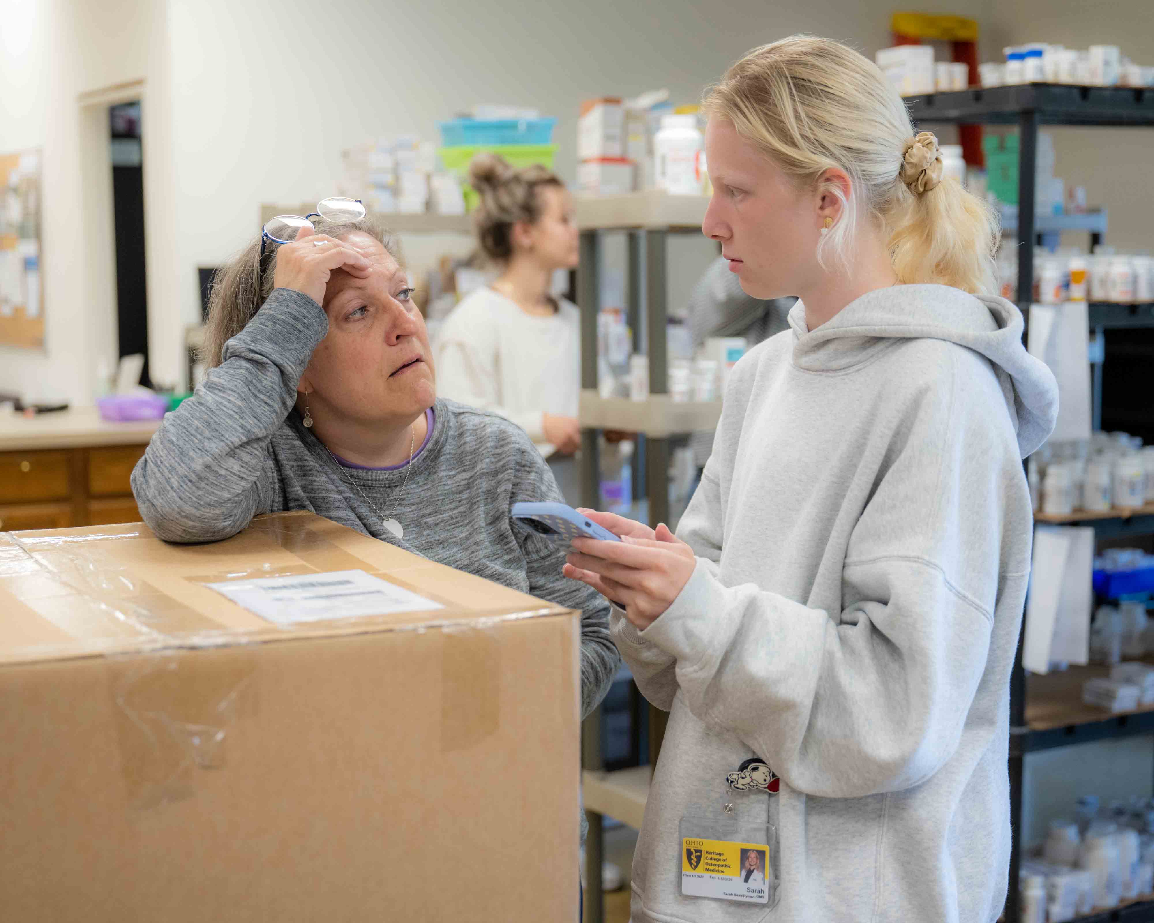 Sarah Adkins talks with first-year medical student Sarah Bevelhymer