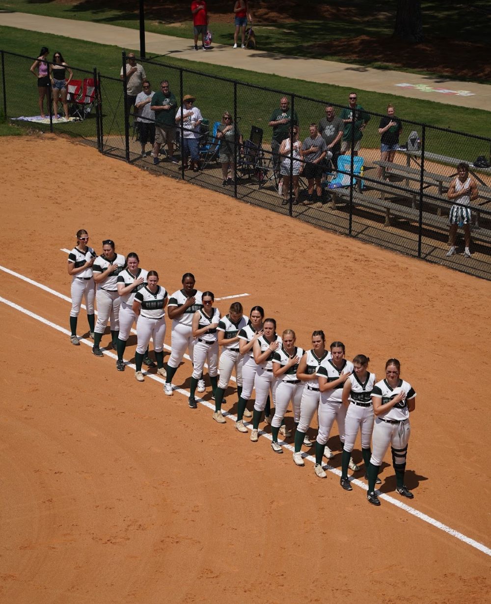 Team standing together for the national anthem