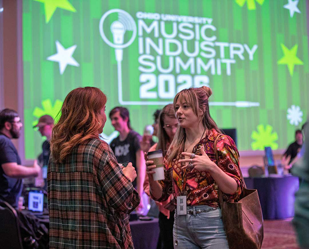 Music Industry Summit attendees converse in the Baker Ballroom after a main stage discussion.
