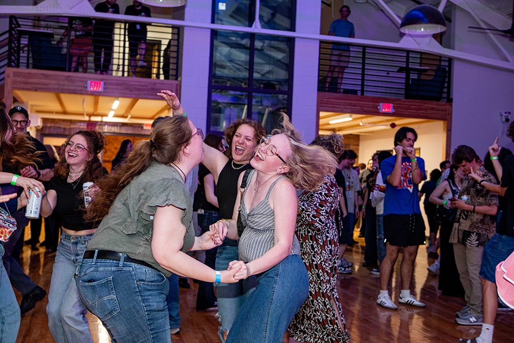 Summit attendees dance at the Official Music Industry Summit Party, presented by Qobuz.