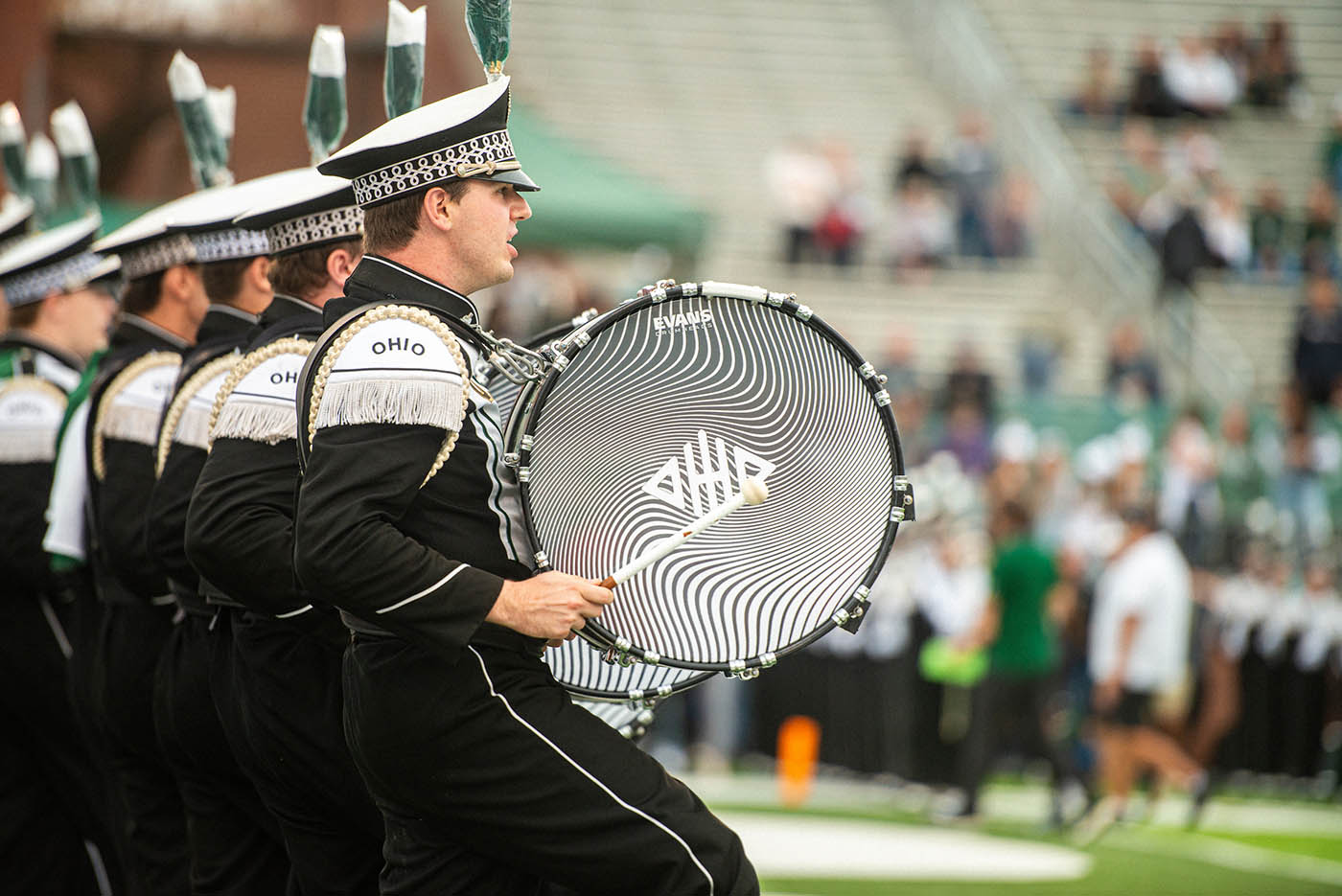 The Marching 110 Drumline performs during pre-game at Peden Stadium.