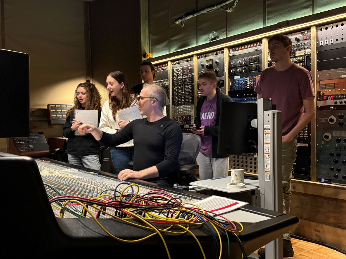 Producer Joel Hamilton sits in his Brooklyn studio with five students