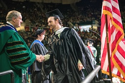 Fall Commencement graduate and Nellis