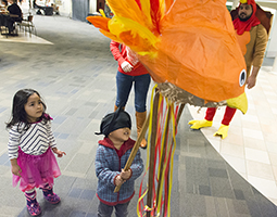 A family-friendly event, the 2015 International Student Thanksgiving Dinner included a turkey piñata.