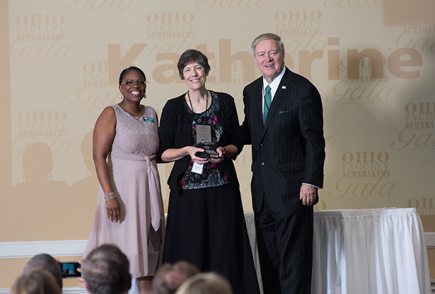 President M. Duane Nellis and Chief Marketing Officer Renea Morris pose for a photo with this year’s top OHIO faculty newsmakers, Dr. Katherine Jellison, who was featured in 1,031 media reports in calendar year 2016.