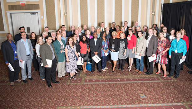 Many of this year’s faculty newsmakers gather after the awards ceremony for a group photo.