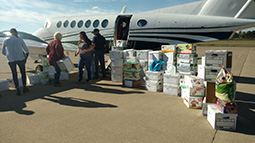 Ohio University staff load the university's plane with supplies bound for Puerto Rico on Wednesday, Oct. 4, at the Ohio University Airport.
