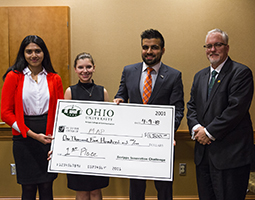 (From left) Members of the first-place team, Mentorship in Appalachia Program, Bharbi Hazarika, Jessica Hill and Mohammad Hashim Pashtun and Dean Scott Titsworth pose for a photo April 9 at the sixth annual Scripps Innovation Challenge Pitch Day.
