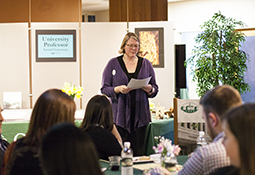 Elizabeth Sayres is shown addressing the crowd at the 2018 University Professor award ceremony.