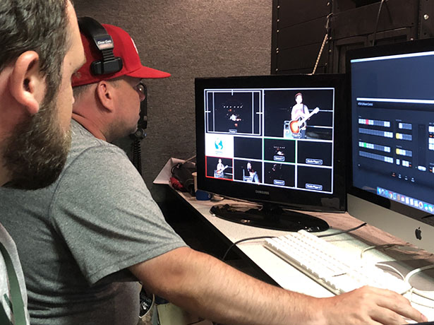 Southern Campus electronic media student Bryan McGlone directs the multi-camera Summer Motion live feed, coordinating video shots from the production truck at the Port of Ashland, Kentucky.