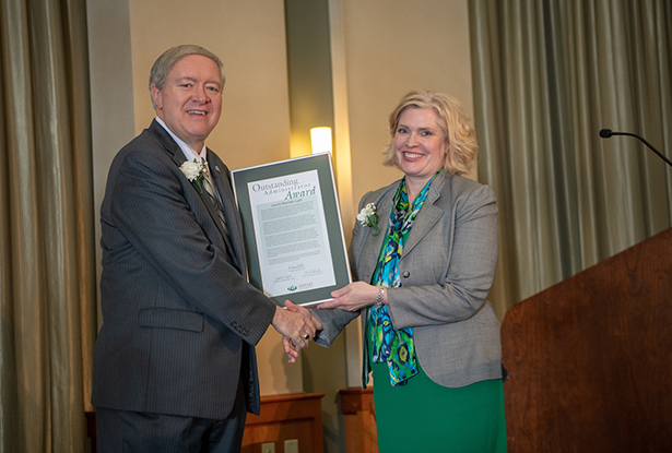 Ohio University President M. Duane Nellis presents a 2018 Outstanding Administrator Award to Laurie Sheridan Lach, director of development and external affairs at Ohio University Lancaster.