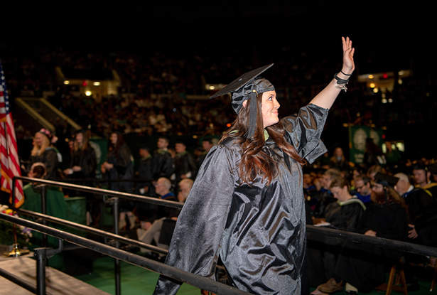 CeCe Chavez waves to those who supported her as she pursued her master of science in recreation and sport sciences.