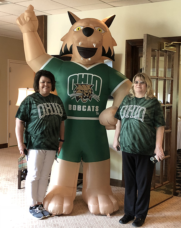 Proctorville Center Director Stephanie Burcham and Student Services Specialist Nina Queen welcome golfers as they arrived for the tournament at the Guyan Golf and Country Club in Huntington, West Virginia.
