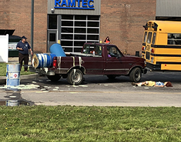 Instructor Charlie Hammonds commands a hazardous incident response scenario for students at the Collins Career Technical Center.