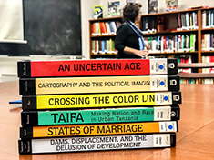 Books in the New African Histories series published by Ohio University Press are stacked on a table.