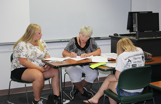 Jamie Harmount, Assistant Professor of Early Childhood Education, helps students arrange their fall schedule at orientation during summer 2018
