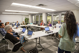 Participants engage in a discussion during a 2018 course design studio.