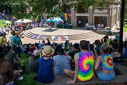 Athens Commnuity members listen to speakers following the city's first PRIDE PARADE. The parade is part of Athens Pride Fest, a week long celebration of solidarity, diversity, unity, and activism.