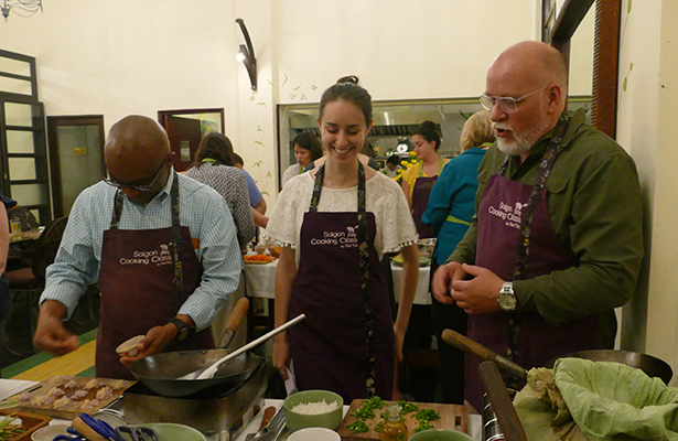 Obi and fellow colleagues participating in the Vietnamese cooking class and competition