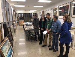 John Rogers, Mrs. Ruthie Nellis, Evan Wilkof, Jeff Carr and Brianne Szymanski take a look at artwork from the Kennedy Museum to display in Baker University Center.