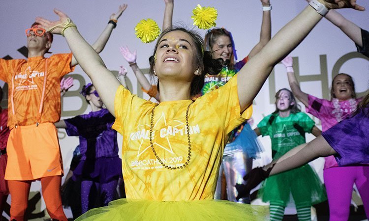 Madison Shoff, an OHIO student majoring in biology and psychology, dances with fellow morale captains during the opening ceremony of Bobcathon 2019.