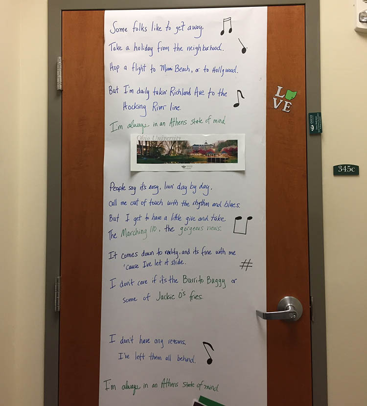 As part of the Paint the Town Green decorations in the Dean of Students office, the door of Senior Associate Vice President of Student Affairs and Dean of Students Jenny Hall-Jones’ office features song lyrics proudly boasting, “I’m always in an Athens State of Mind.” 