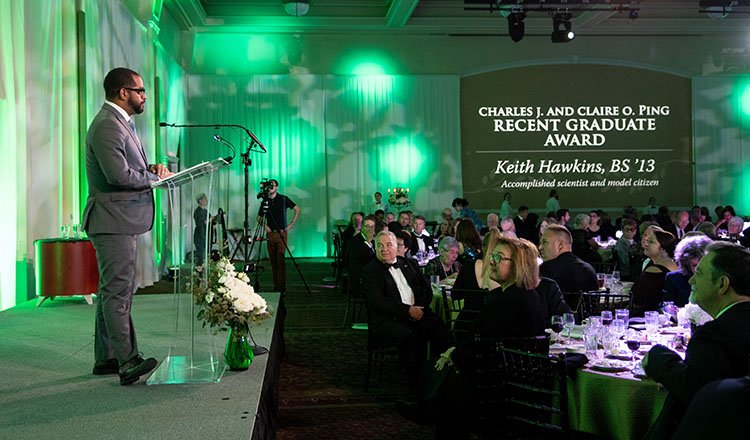 Keith Hawkins, BS ’13, addresses those at the Alumni Awards Gala after receiving the 2018 Charles J. and Claire O. Ping Recent Graduate Award. 