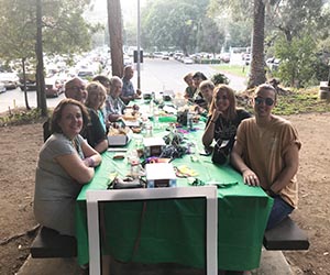 Los Angeles-area Bobcats and friends of Ohio University enjoy a picnic under palm trees at the annual OHIO Alumni Night at the Hollywood Bowl.