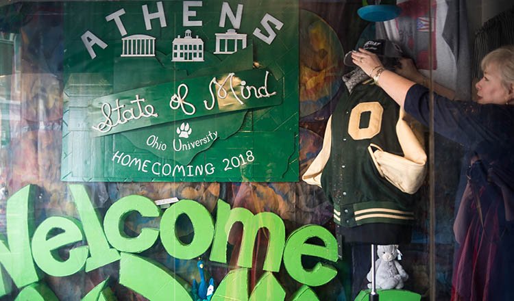 The finishing touches are put on Mountain Laurel Gifts’ 2018 Paint the Town Green display.