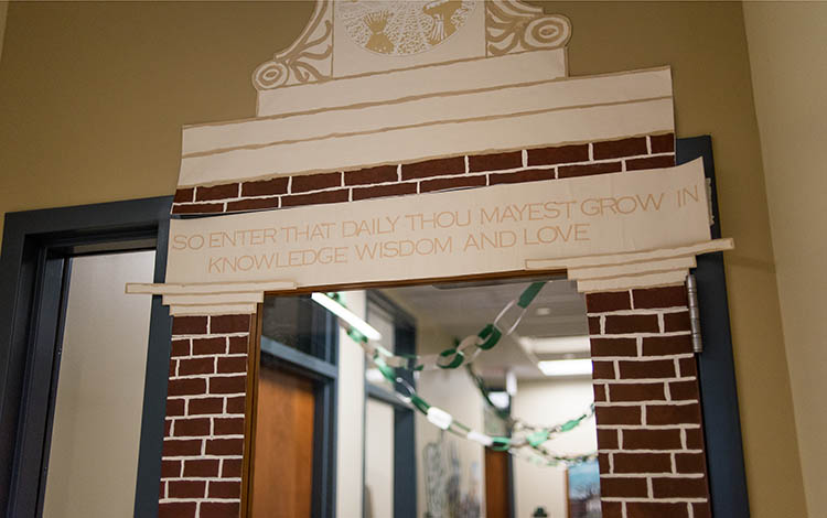 Staff in the Department of Human and Consumer Sciences transformed their office’s entrance into a replica of OHIO’s iconic Alumni Gateway for this year’s Paint the Town Green contest.)