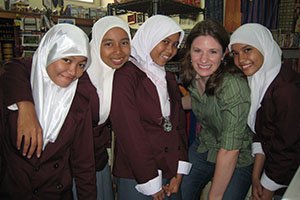 Victoria Augustine, BSJ ’96, MA ’98, poses for a photo with women in Indonesia. A resident assistant in Scott Quad, an administrative resident assistant for the Tiffin/Gamertsfelder Complex, an assistant resident director in the Shively/Perkins Complex, and a graduate resident director in Bryan Hall, Augustine credits her education and experiences at OHIO for her post-graduation success.