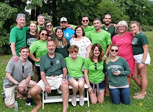 Members of Tyler Weymouth’s Bobcat family gather for a photo with his family and friends back home during this past summer’s fourth annual TyAthlon, a cornhole tournament that raises money for the nonprofit Tyler Weymouth Memorial Foundation. 