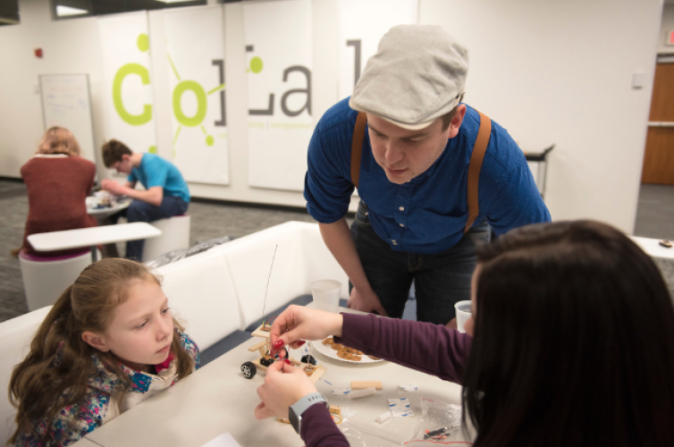 Students and their siblings participate in a remote control car building activity at the CoLab in Alden Library during Sibs Weekend on Feb. 2, 2019.