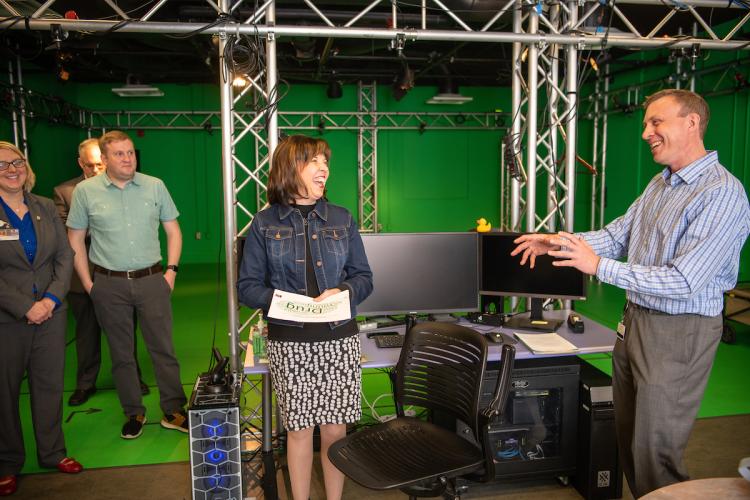 Cinematographer Matt Love (Right) talks with Anne Hazlett, Sr. Adviser For Rural Affairs about the virtual realty Narcan treatment they helped develop at the GRID Lab in the Scripps College of Communication at Ohio University.