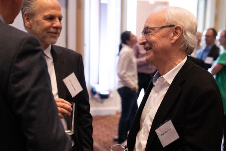 President Hugh Sherman congratulates Lawrence Lynn at the annual Inventors dinner.