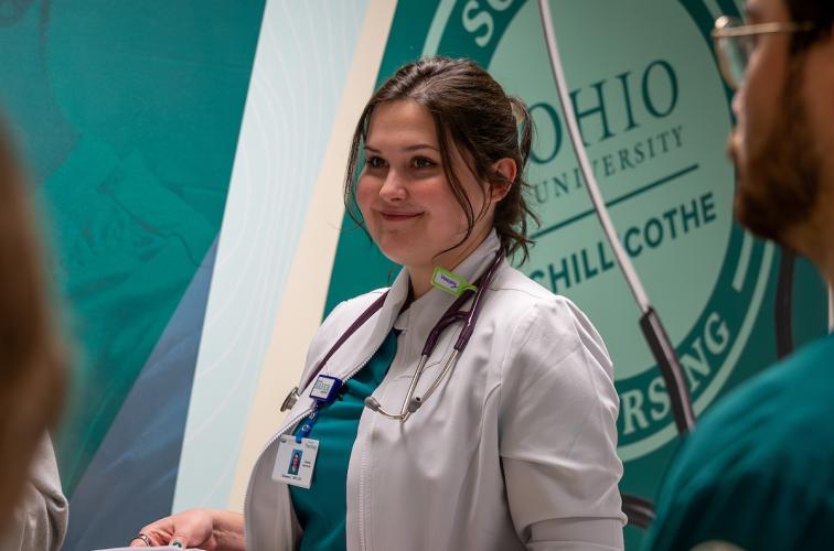 A nursing student at OHIO Chillicothe engages with other students