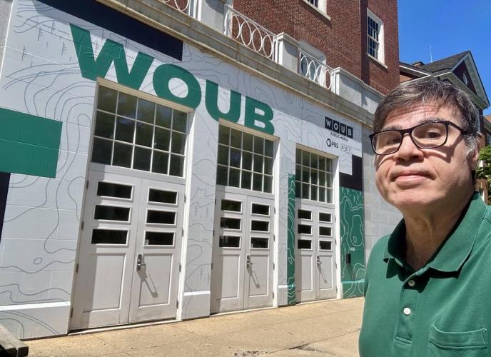 Robb Metry is shown outside of the WOUB building at Ohio University