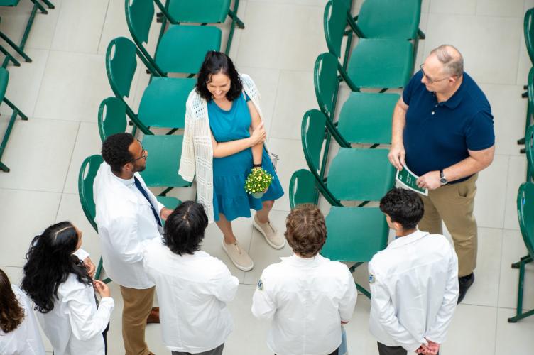 Heritage College students meet with those who attended the body donor memorial to honor their loved ones.