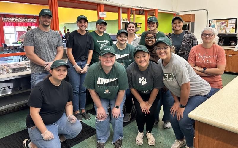 OHIO Zanesville students pose for a photo while working at the Christ's Table organization