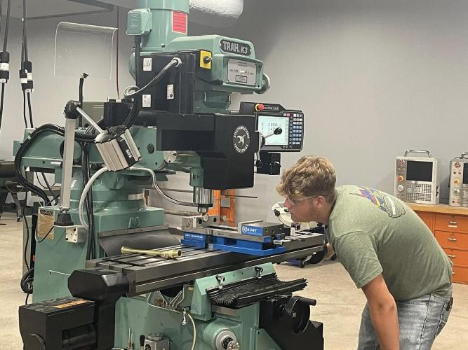 An OHIO students uses laboratory equipment at the Fairfield County Workforce Center