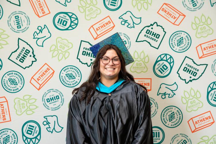 Alyssa Manning is shown wearing her Commencement Cap and Gown